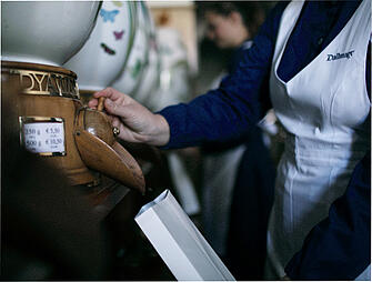 A Dallmayr employee fills a bag with coffee beans at the delicatessen in Munich